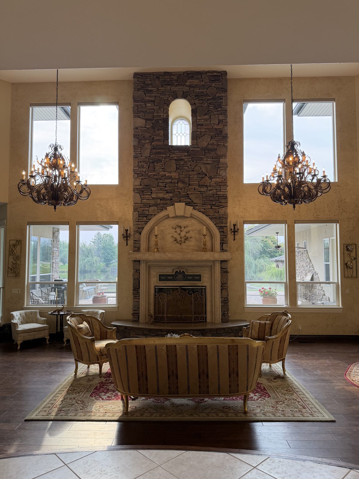 Chandeliers installed in a two-story great room by Keely Electric